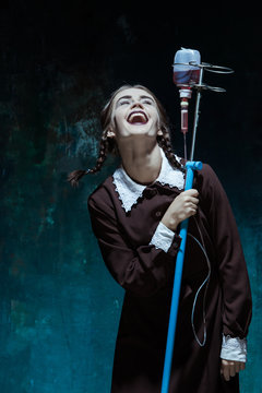 Portrait of a young girl in school uniform as a vampire woman