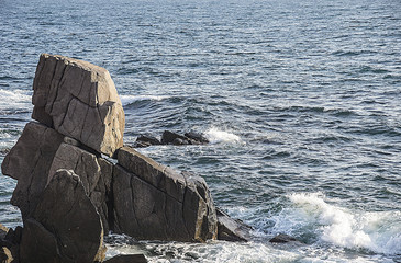 Stone rock acts in the sea