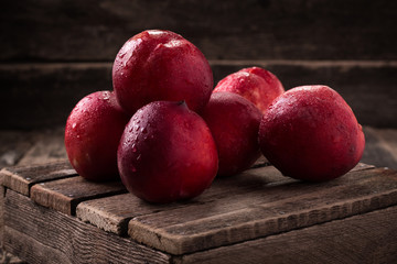 sweet fresh ripe nectarines on wooden table