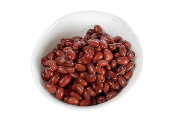 Red beans in a dish on a white background