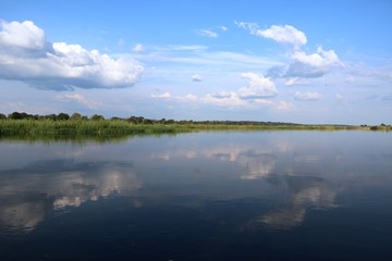 Fototapeta na wymiar Clouds reflected in the Okavango, Caprivi strip of Namibia Africa