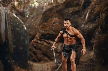 Manly warrior at the mountains