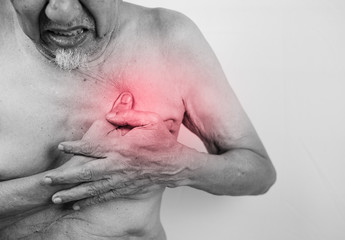 Naklejka premium acute pain possible heart attack, senior man is clutching he che