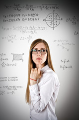Woman in white is solving equation