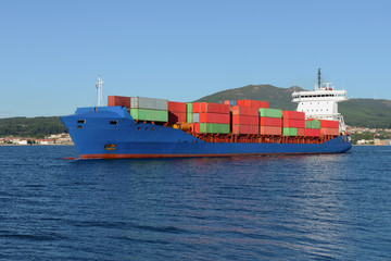 tanker carrying containers in the port