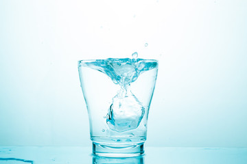 water splash in glasses isolated on white