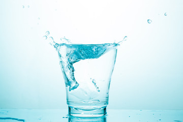 water splash in glasses isolated on white