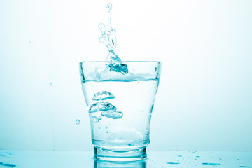 water splash in glasses isolated on white