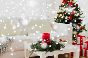 Fototapeta na wymiar sofa, table and christmas tree with gifts at home