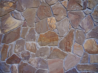 Fototapeta premium pattern color decorative uneven cracked real stone wall