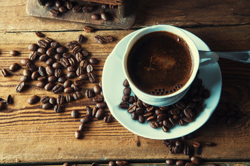 Cup of coffee with freshly ground beans. Top view. Copyspace