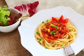 Pasta with pork and tomato sauce.