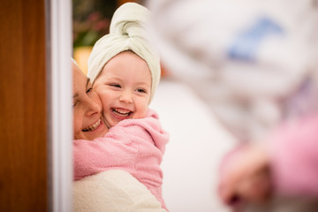 Mother and child - fun in bathrobes