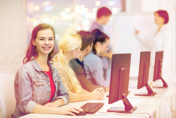 smiling teenage girl with classmates and teacher