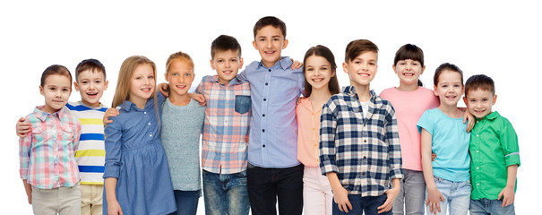 group of happy smiling children hugging over white