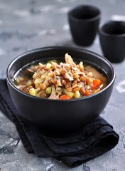 Lentil soup with chicken meat, potatoes, carrots and dill.