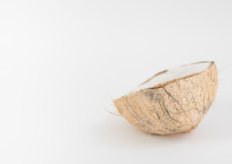 half of coconut on white background