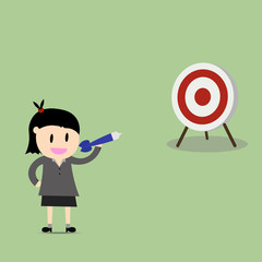 businesswoman pointing in a target board. Concept of achievement