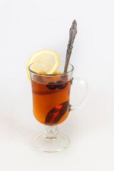 glass of ice tea with lemon on white background, A glass of herbal tea with sliced lemon on white background lemon tea for colds and flu herbs