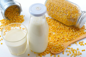 Soy milk in glass with soybeans. Food for health.