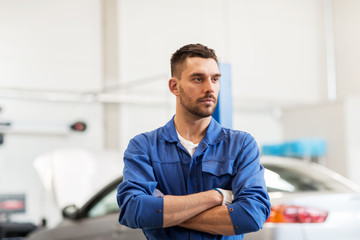 auto mechanic man or smith at car workshop