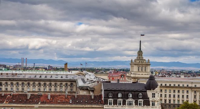 Rooftops of Sofia, Bulgaria - view from the top of a hotel in downtown city center towards the house of Parliament - timelapse