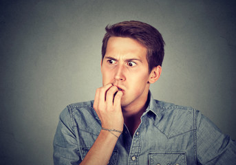 Anxious stressed young man looking away