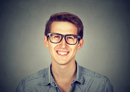 handsome man with great smile wearing fashion eyeglasses