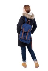 Back view woman in winter jacket with a backpack  looking up.   Standing young girl in parka. Rear view people collection.  backside view of person.  Isolated over white background.
