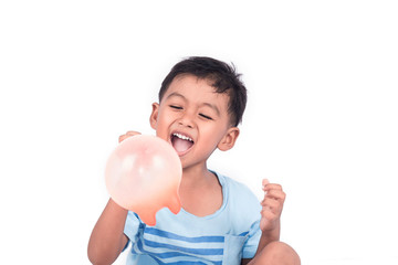 Close up of cute little boy happy and smile white play balloon