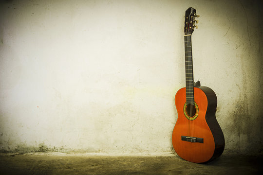 Guitar on background of a wall