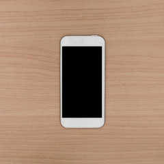 Smart phone on wooden background