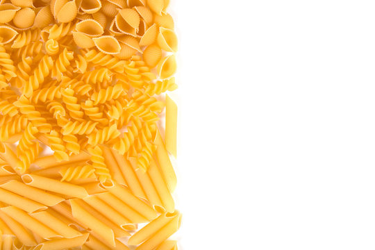 Raw pasta on white background
