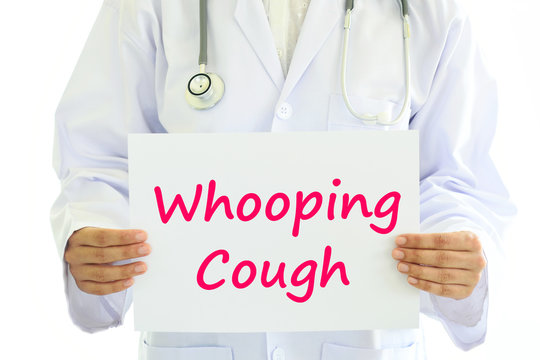 Doctor Holding Whooping Cough Card In Hands