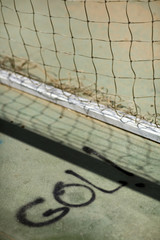 The Spanish word "gol!" (goal!) painted on the ground by a football goal, Seville, Spain © Felipe Rodríguez