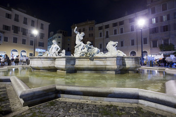 Nocturnal view of Neptune fountain at Navona square, Rome