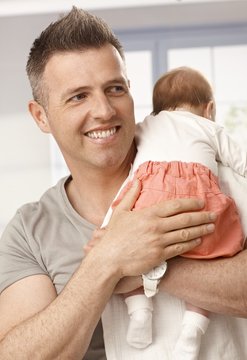 Closeup photo of happy father and baby girl