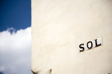 Sol Street sign, Seville, Spain. Sol means sun.