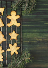 Christmas ginger gingerbreads with honey and cinnamon on a woode