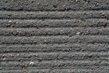 Asphalt texture background. Horizontal prints lines.