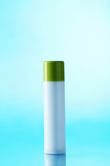 White cosmetic bottle on a blue background