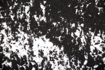 Extreme macro image of black pigment on paper background texture