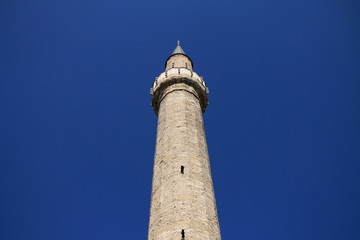 Fototapeta na wymiar Mosque minaret in Sarajevo with beautiful blue sky , Bosnia and Herzegovina