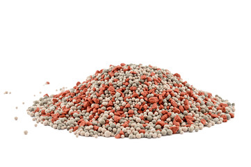 Heap of composite mineral fertilizers isolated on white