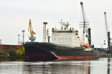 The icebreaker is moored to the pier.
