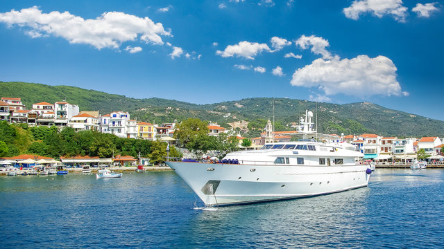 Skiathos town on Skiathos Island, Greece. Beautiful view of the old town with boats in the harbor.