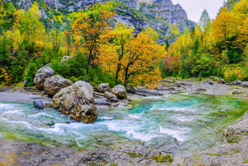 Naklejka na ściany i meble Autumn in mountain gorge. Ordesa National Park. Aragon Province. Spain
