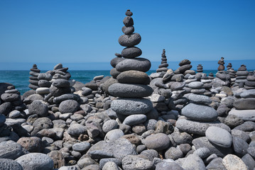 Huge amount of zen stones piled in the beach, Puerto de la Cruz,