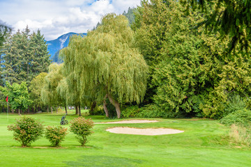 Golf course with gorgeous green and sand bunker
