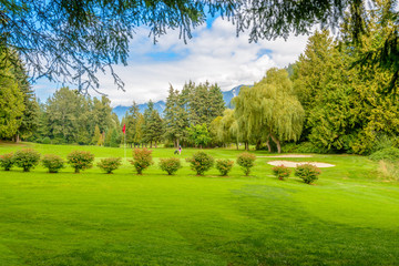 Golf course with gorgeous green and sand bunker